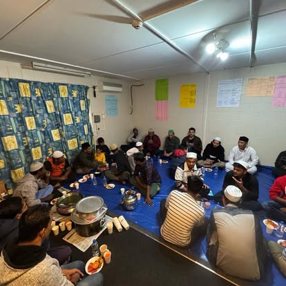 MAM community sharing a meal together